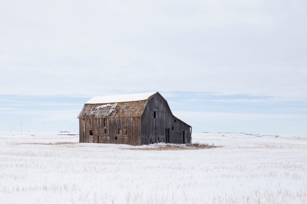 old barn in snowy field